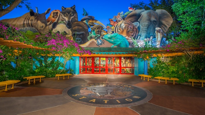 Conservation Station's colorful outdoor entrance surrounded by huge animal cutouts