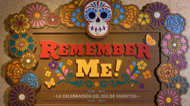 A sign that reads Remember Me La Celebracion Del Dia De Muertos