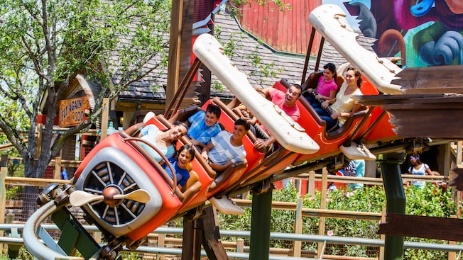 Guests delight in riding The Barnstormer rollercoaster attraction in Fantasyland