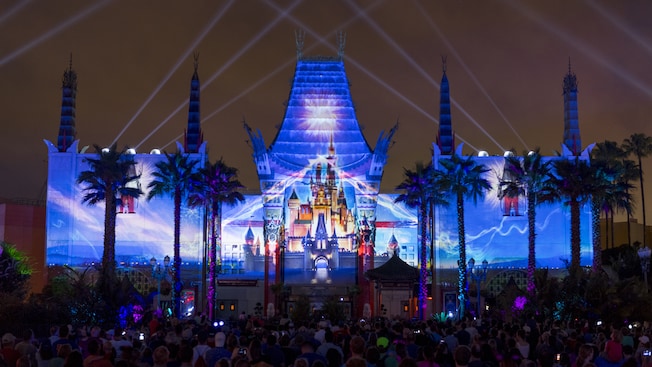 An image of Cinderella Castle projected onto the facade of Grauman’s Chinese Theatre