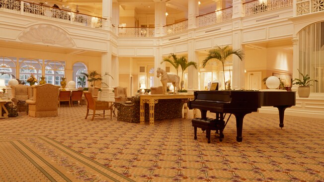 A grand piano sits in the center of the elegant hotel lobby at Disney's Grand Floridian Resort & Spa