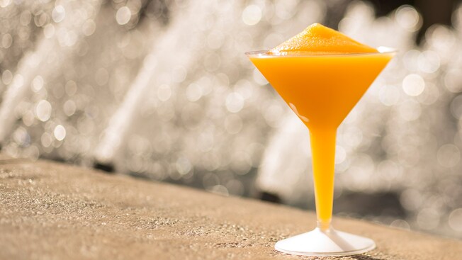 A Grand Marnier Slush ice drink served in a plastic cocktail glass