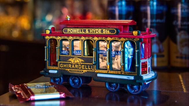 A model San Francisco trolley car holds wrapped squares of Ghirardelli chocolate