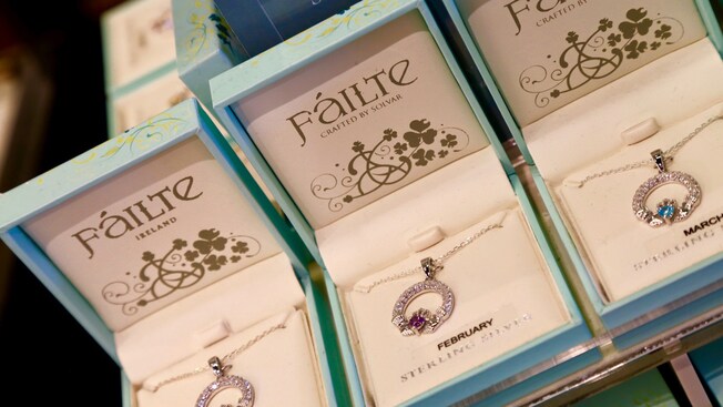 Three birthstone pendants on display