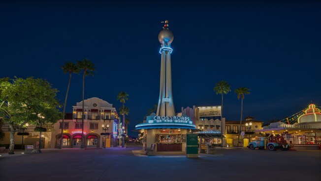 Crossroads of the World area at Disney's Hollywood Studios, lit up at night