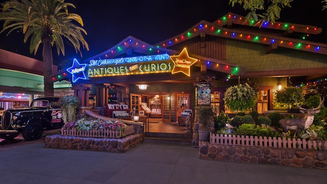 Sid Cahuenga's One-of-a-Kind Shop at Disney's Hollywood Studios, lit up at night