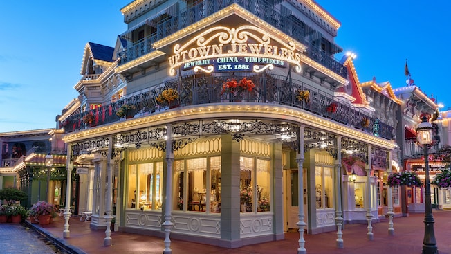 Exterior of Uptown Jewelers on Main Street, U.S.A., lit up in the evening