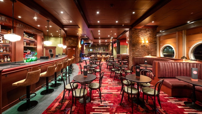 A jazz club inspired bar with cocktail tables at Soul Cat Lounge aboard the Disney Magic A jazz club inspired bar with cocktail tables at Soul Cat Lounge aboard the Disney Magic