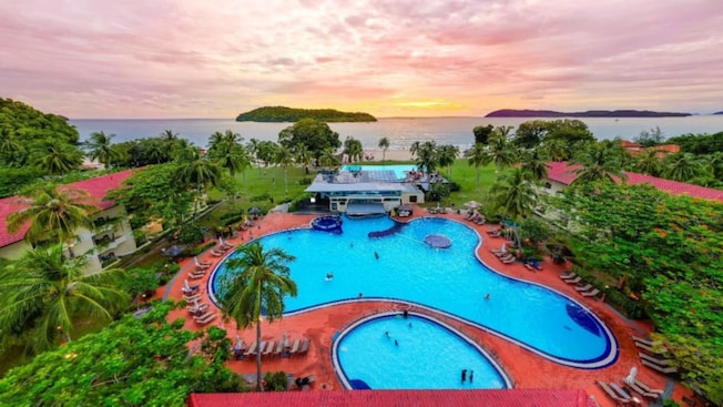 Elevated view of Holiday Villa Resort & Beachclub Langkawi with swimming pools, tropical gardens and island views Elevated view of Holiday Villa Resort & Beachclub Langkawi with swimming pools, tropical gardens and island views