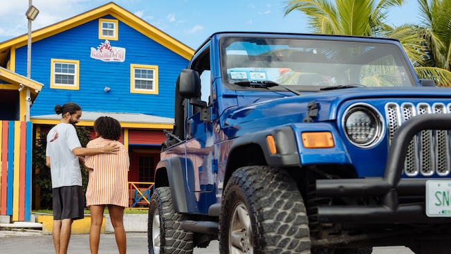 Two Guests standing next to a Jeep in front of Bahama Grill Café Two Guests standing next to a Jeep in front of Bahama Grill Café
