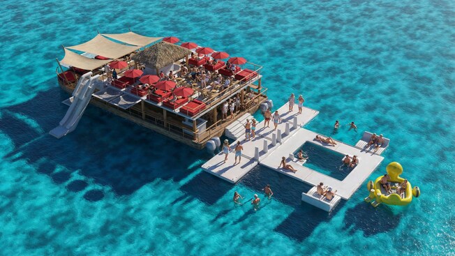 A floating ocean club featuring lounge chairs and a bar in Cozumel, Mexico