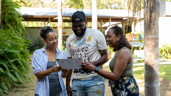 Three Guests examining a cultural tour map Three Guests examining a cultural tour map