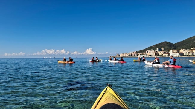 Guests paddling kayaks on the waters of Ajaccio, France Guests paddling kayaks on the waters of Ajaccio, France