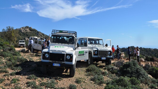 Four off road vehicles parked in the mountains of Cagliari, Italy during an off road tour