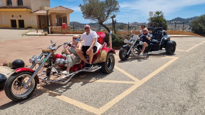 Four Guests sitting on 2 motor trikes in Cartagena, Spain