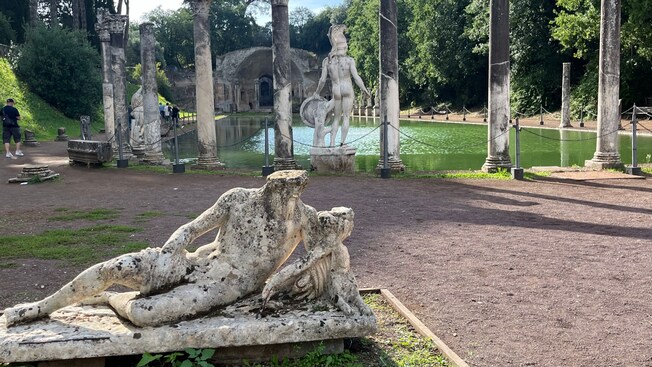 Ruins of 2 statues in a park at Hadrian’s Villa in Tivoli, Italy