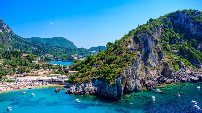 Panoramic view of the seaside village of Paleokastritsa in Corfu, Greece. Panoramic view of the seaside village of Paleokastritsa in Corfu, Greece.