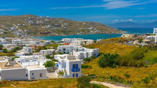 Hills above a bayside village on the island of Mykonos Hills above a bayside village on the island of Mykonos