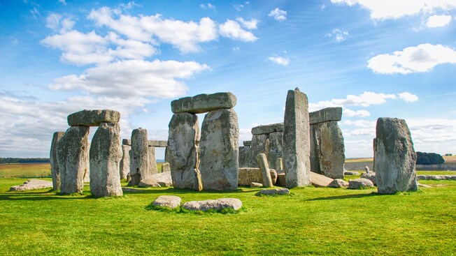 The ancient standing stones of Stonehenge on the grassy Salisbury Plain in southwest England
