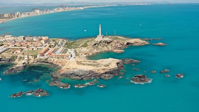 Panoramic view of Cabo de Palos and its lighthouse in Cartagena, Spain Panoramic view of Cabo de Palos and its lighthouse in Cartagena, Spain