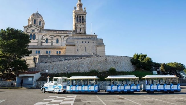 The Petit Train of Marseille parked in front of Notre Dame de la Garde The Petit Train of Marseille parked in front of Notre Dame de la Garde