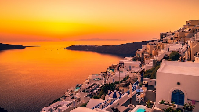 A sunset over the village of Oia on the island of Santorini, Greece A sunset over the village of Oia on the island of Santorini, Greece