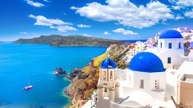 A traditional domed church on a hill above the Santorini caldera