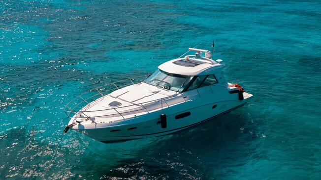 A sleek yacht anchored in the water off the shore of Cozumel