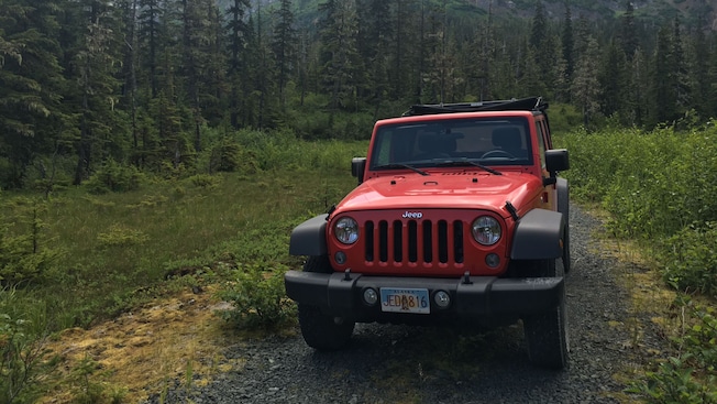 An off road vehicle on a rugged trail in Chichagof Island, Alaska An off road vehicle on a rugged trail in Chichagof Island, Alaska