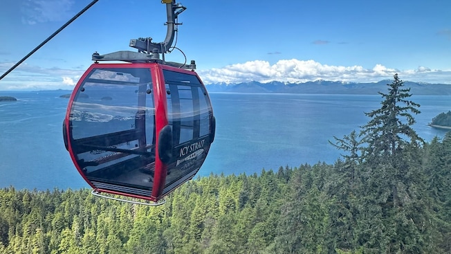 A gondola traveling along a mountainside overlooking Icy Strait Point, Alaska A gondola traveling along a mountainside overlooking Icy Strait Point, Alaska