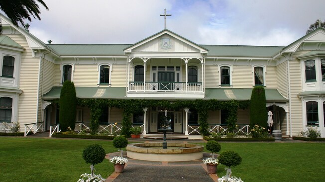 The Mission Estate Winery with a circular fountain in front