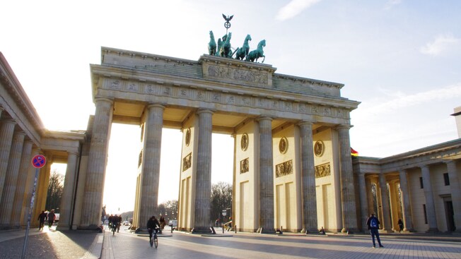The Brandenburg Gate with 6 columns and a statue of a horse drawn chariot at the top