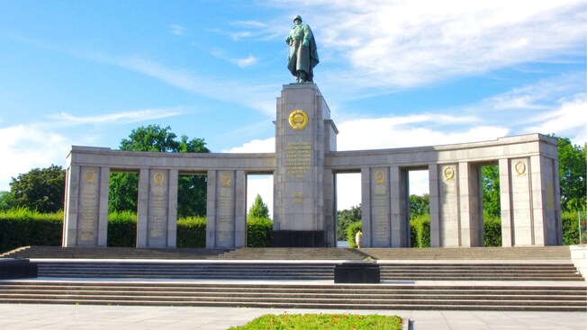 The stone columns and statue of a Soviet soldier at the Soviet War Memorial in Berlin