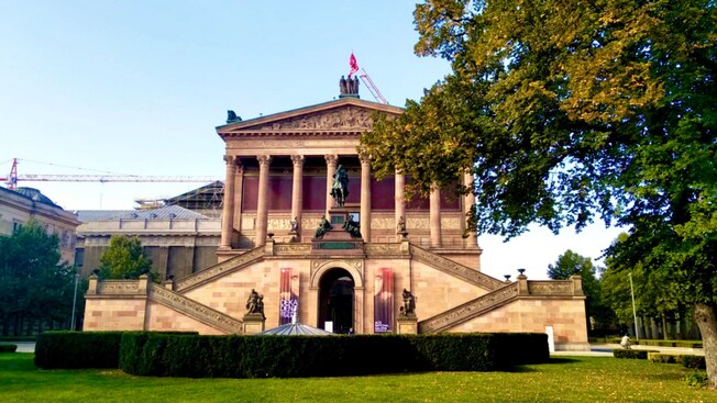 An imperial staircase leading up to the columned entrance of the Old National Gallery in Berlin