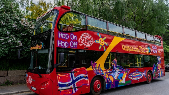 A double decker tour bus with the words ‘Hop On Hop Off’ and ‘City Sightseeing Norway’ A double decker tour bus with the words ‘Hop On Hop Off’ and ‘City Sightseeing Norway’