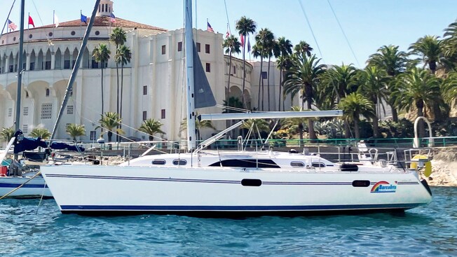 A sailboat at a harbor near the Catalina Casino at Santa Catalina Island