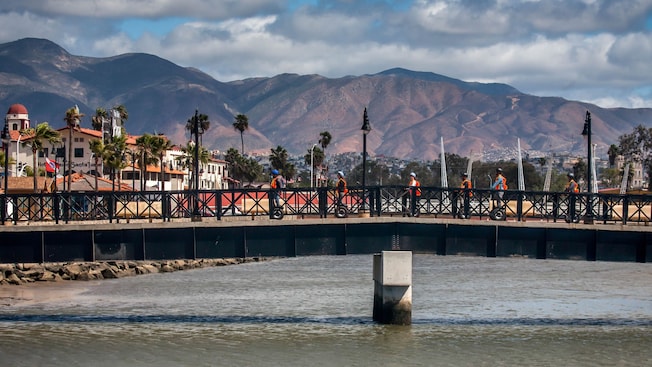 Guests riding segways across a bridge on a boardwalk in Ensenada, Mexico Guests riding segways across a bridge on a boardwalk in Ensenada, Mexico