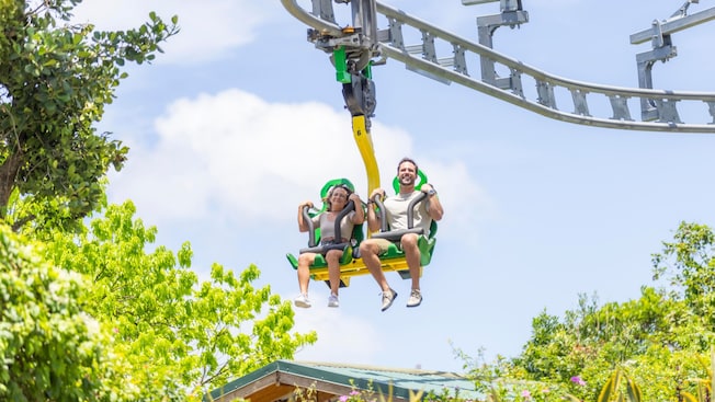 A couple riding the Raggamuffin, an inverted rollercoaster A couple riding the Raggamuffin, an inverted rollercoaster