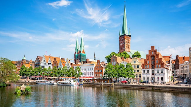 Historical gabled buildings built alongside a lake Historical gabled buildings built alongside a lake