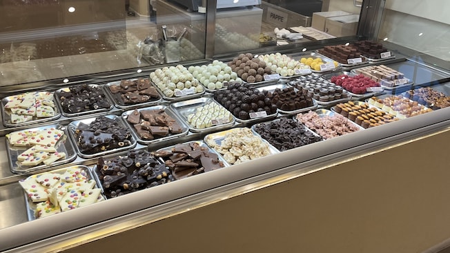 A display case with different types of chocolates at Chocoversum, a chocolate museum in Hamburg, Germany A display case with different types of chocolates at Chocoversum, a chocolate museum in Hamburg, Germany