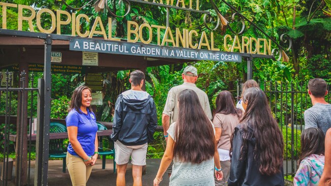 Guests entering the front gates of the Hawaii Tropical Bioreserve and Garden