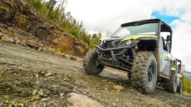 A Utility Terrain Vehicle parked outside A Utility Terrain Vehicle parked outside