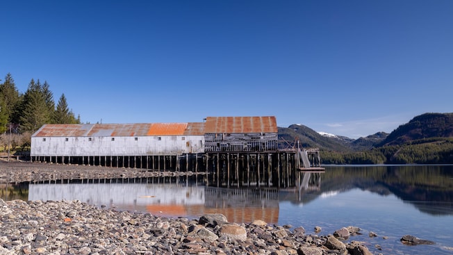 The George Inlet Cannery along a fjord in Ketchikan, Alaska The George Inlet Cannery along a fjord in Ketchikan, Alaska