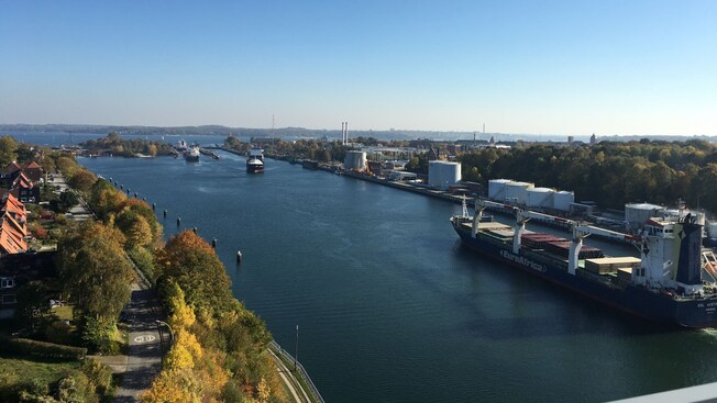 Cargo ships traveling across the Kiel Canal in Kiel, Germany