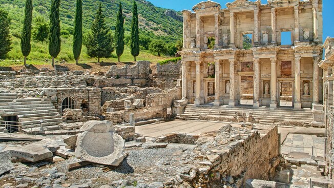 The ruins of the Library of Celsus reveals a building with stairs, columns and statues