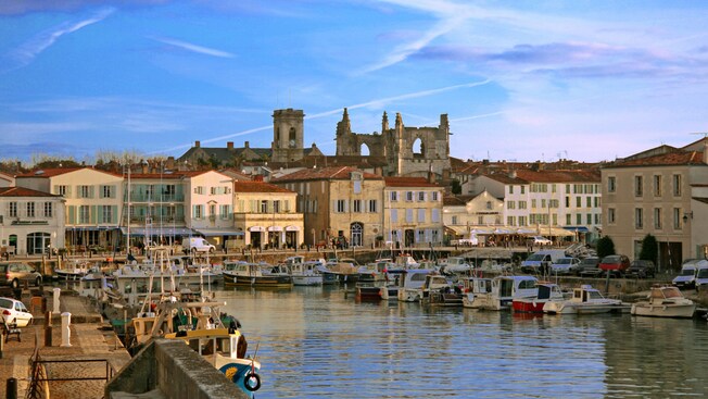 A harbor with boats and European style architecture