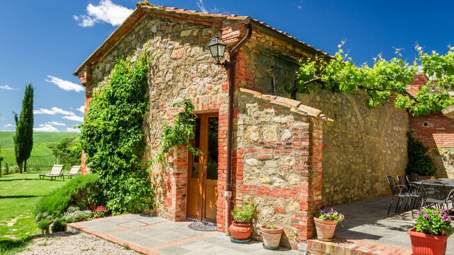 A villa in the Italian countryside covered in foliage