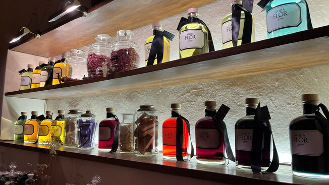 Bottles of perfumes on shelves inside Aquaflor Florence
