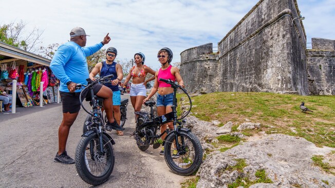 A group of people on bicycles in Nassau, The Bahamas