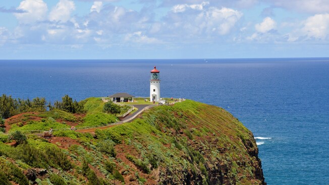 A lighthouse on a bluff on the island of Kauai